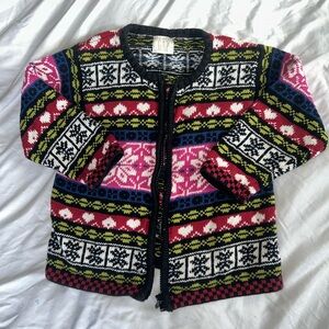 Vibrant Pink and Black Sweater with Intricate Patterns